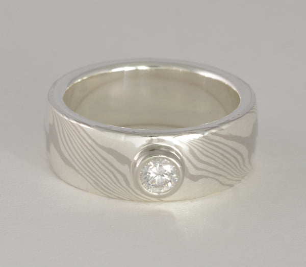 Custom: 14kt Palladium White Gold and Sterling Silver Wide band with Bezel Set Diamond