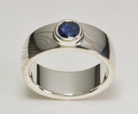 Custom: Palladium White Gold and Sterling Silver Mokume Ring with Bezel Set Blue Sapphire