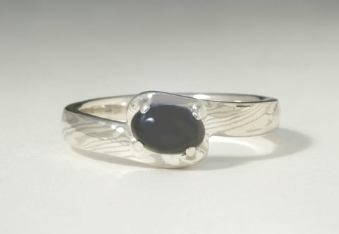 Custom: 14kt Palladium White Gold and Sterling Silver Offset Mokume Gane Ring with Prong Set Coral